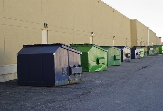 large roll-off dumpsters prepared for construction waste in Allston, MA